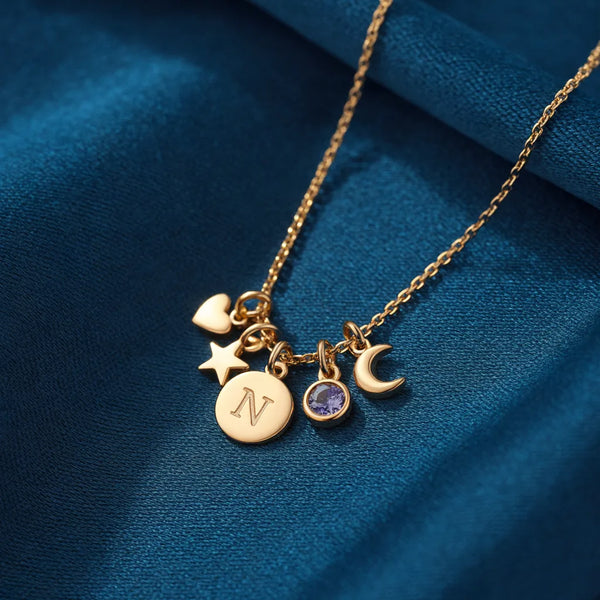 Gold charm necklace with five mixed charms, design preview