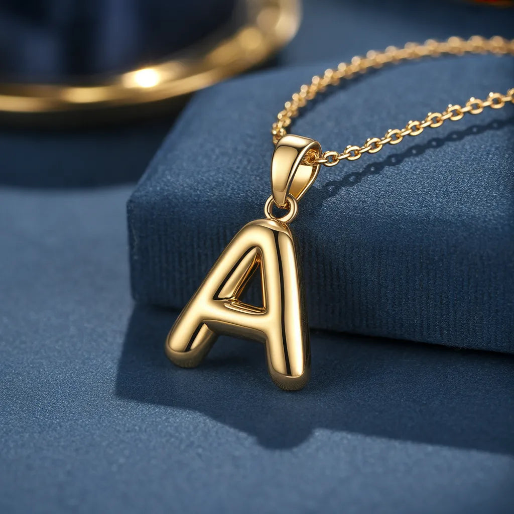 Bubble initial pendant in gold, design preview